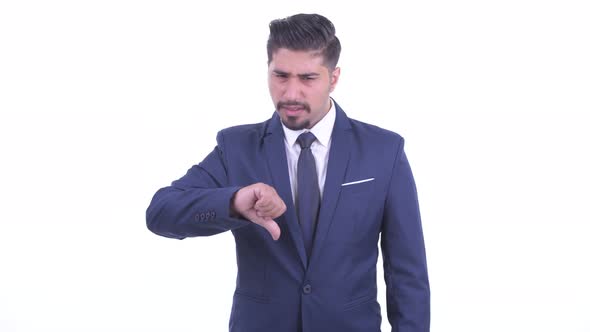 Angry Bearded Persian Businessman Giving Thumbs Down