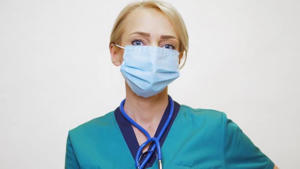 Medical Doctor Nurse Woman with Stethoscope Wearing Protective Mask and Rubber or Latex Gloves
