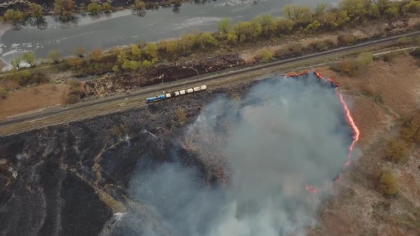 Aerial View of Wildfire Spreading Flames of Forest Fire