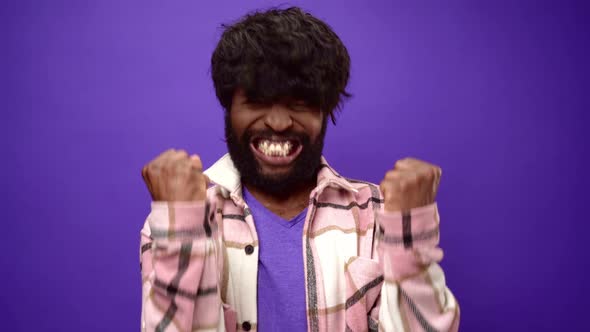 African American Guy with Surprised and Happy Purple Background