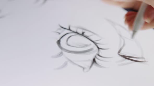 Close up of a digital pen drawing artwork on a graphic tablet