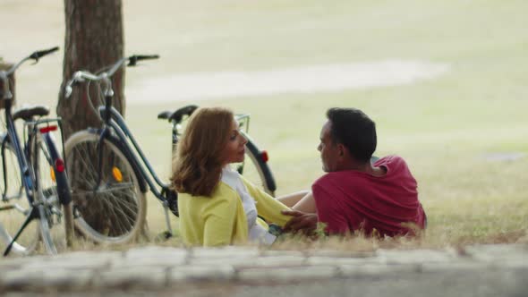 Long Shot of Happy Wife and Husband Lying on Lawn