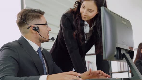 Business People Wearing Headset Working in Office