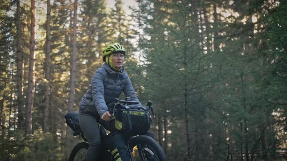 The Woman Travel on Mixed Terrain Cycle Touring with Bike Bikepacking. The Traveler Journey with