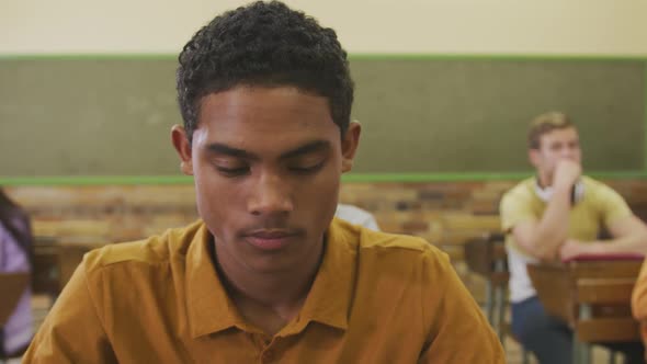 Student concentrating in high school class