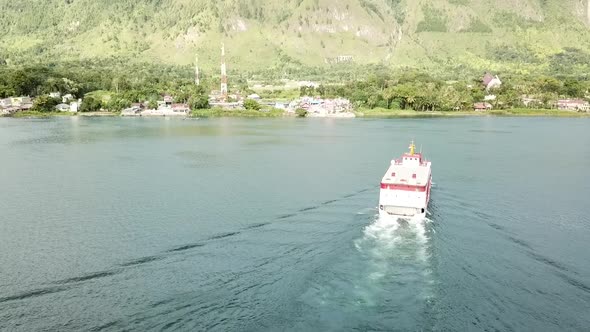 Drone view of ferry near port at Samosir Island in Lake Toba, Sumatra, Indonesia.