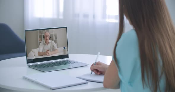 Girl School College Student Distance Learning Waving Hand Studying with Online Teacher on Laptop