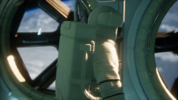 Astronaut Inside the Orbital Space Station alt