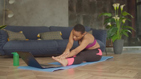Black Female Warming Up Doing Stretching Exercise