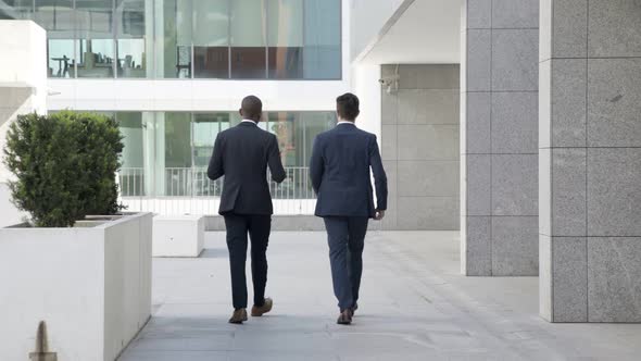 Diverse Businessmen Walking Outdoors
