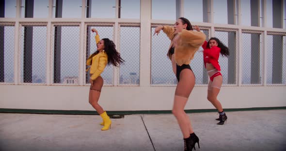 Female Dance Crew Performing On Rooftop