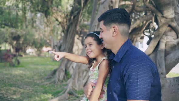 Daughter shows something to her dad