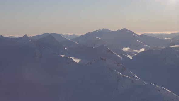 Aerial Panoramic View of Canadian Mountain Covered in Snow