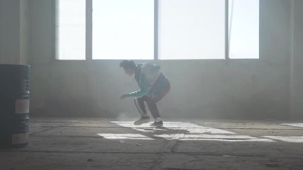 Skillful Young Man Dancing in an Abandoned Building. Hip Hop Culture