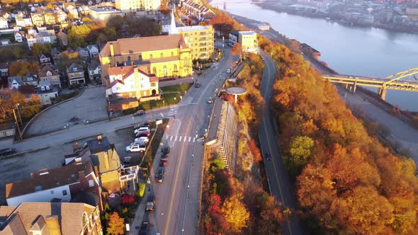 A lowering aerial view of traffic on Mt. Washington overlooking Pittsburgh, Pennsylvania on an early