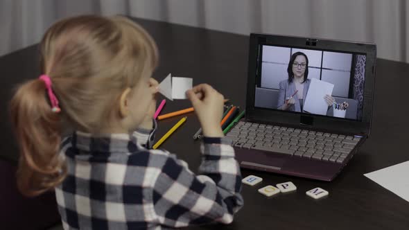 Children Distance Education on Laptop, Online Lesson at Home with Woman Teacher