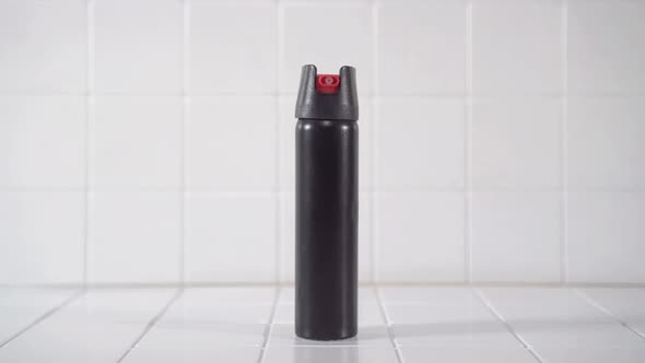 Black Pepper Spray Can on White Background Close Up