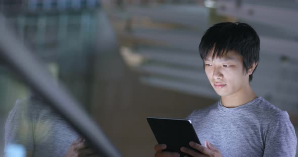 Young Man Use of Tablet Computer at Outdoor