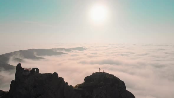 Ascending View Of Stunning Kojori Fortress Above Clouds With Person Standing