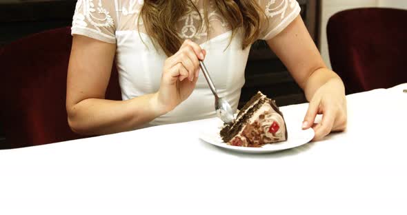 Business woman eating a chocolate cake 4k