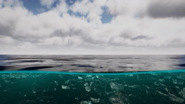 Split View Over and Under Water in the Caribbean Sea with Clouds