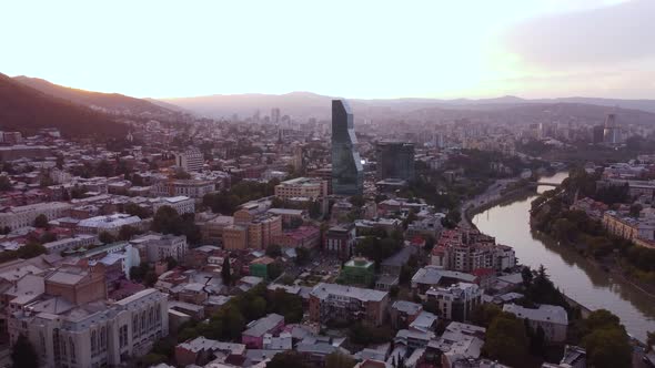 Glass Skyscraper In The Sunset City