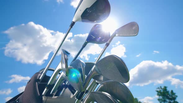 The Sky and the Golf Clubs Stacked Together