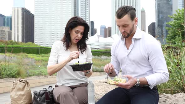 Business people having lunch at park in Chicago