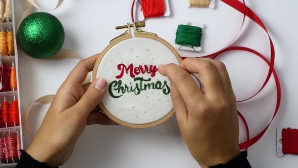 Merry Christmas wooden hoop embroidery as decoration for home or Christmas tree. Crafts, Holidays.