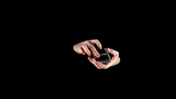 Magician Starts Showing His Trick with Cards on Black, Slow Motion