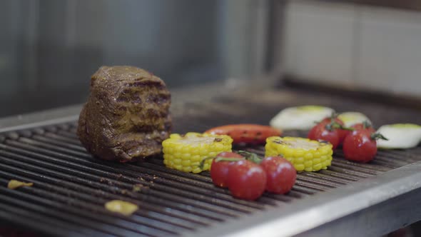 Veal Steak, Tomato Cherry, Corn, Lemon Grass on the Grill Oven