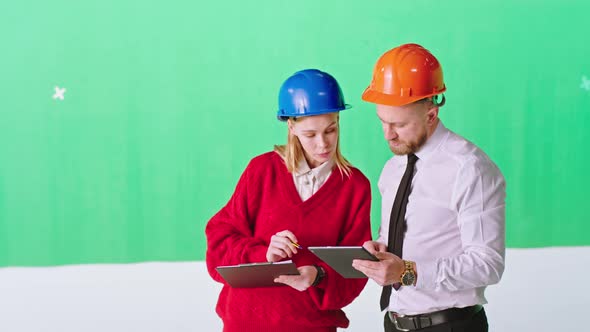 Two Engineers Lady and Man in a Green Background