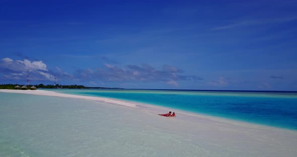 Young boy and girl married on vacation spend quality time on beach on white sand 4K background