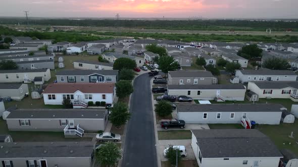 Rural Texas neighborhood community in small town. Low income housing project. Rising aerial.