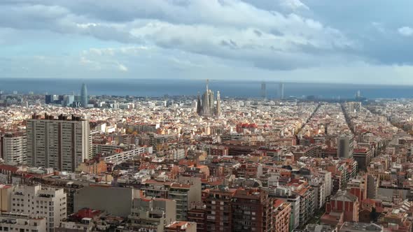 Aerial drone view of Barcelona, Spain. Blocks with multiple residential buildings, Sagrada Familia i