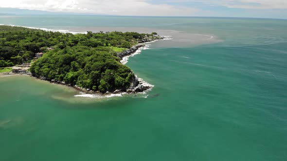 drone shot of an island over the sea