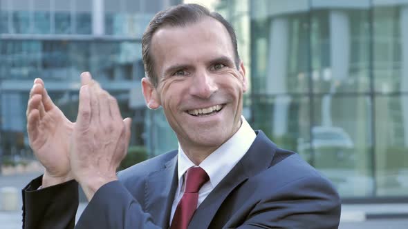 Applauding Sucessful Businessman Clapping