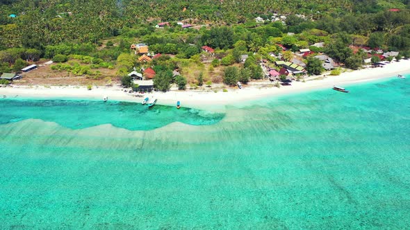 Perfectly clear sea and white sand beach, island with luxury resorts and bungalows, thailand