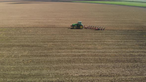 Aerial Tractor Plows Sodpodzolic Gley Soil