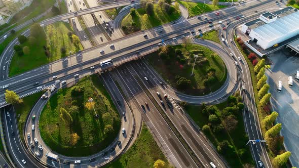 Aerial View of Freeway Intersection with Moving Traffic Cars