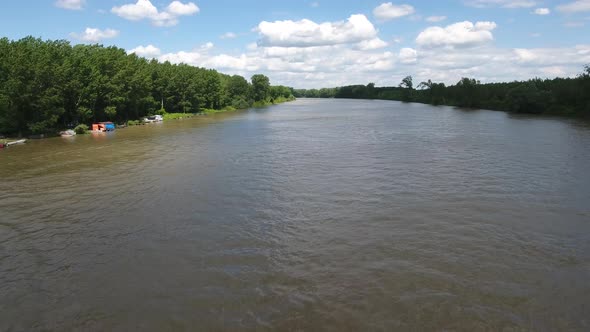 Flying Backwards Above River