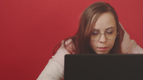 Young Woman Using Laptop in Studio