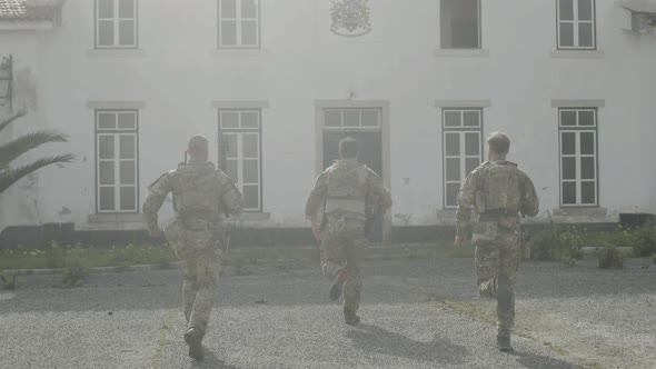 Armed Soldiers Entering Hostile Building