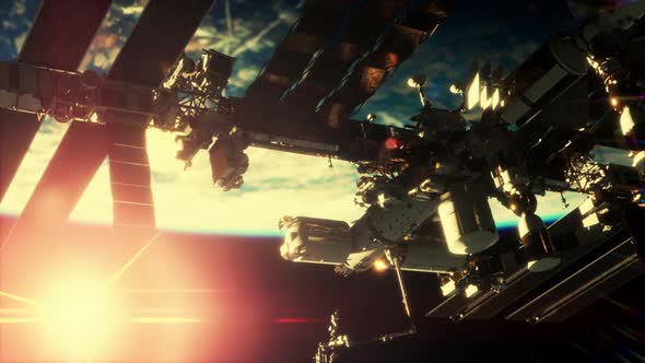 View of the Earth and International Space Station is Orbiting the Earth alt