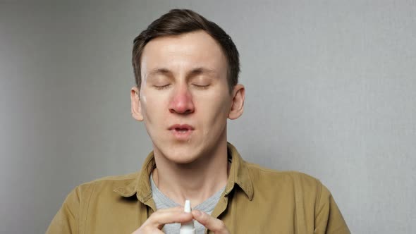 Man Sprays Nasal Medication Into Nostrils to Get Relief