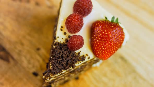 A Slice of Strawberry and Raspberry Cake and Slices Pressed with Chocolate