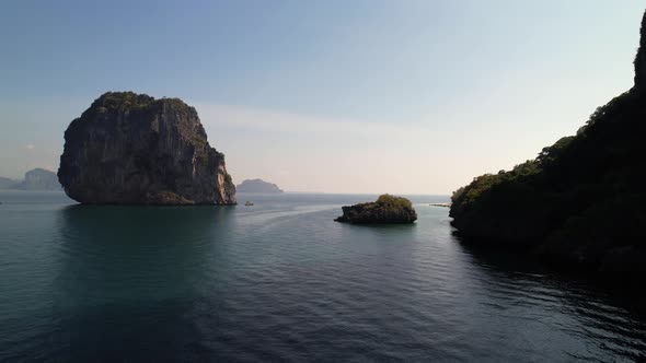 wide aerial of a limestone rock in the middle of the Andaman Sea near Ko Poda Island during sunrise