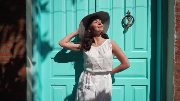 Live Camera Zoom in to Smiling Beautiful Confident Woman Standing on Sunny Day at Turquoise Green