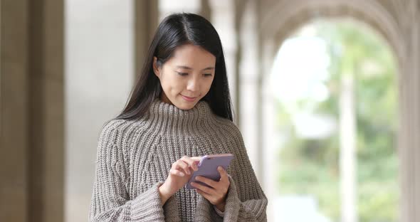 Woman Use of Mobile Phone at Outdoor