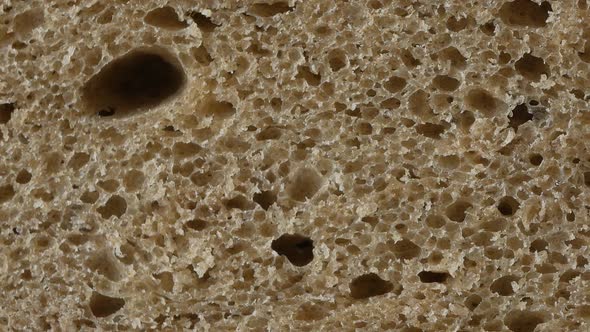 A slice of brown bread, up close